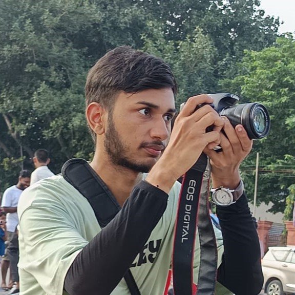 Nayan, The Author of Travelkaise clicking stunning photos with DSLR